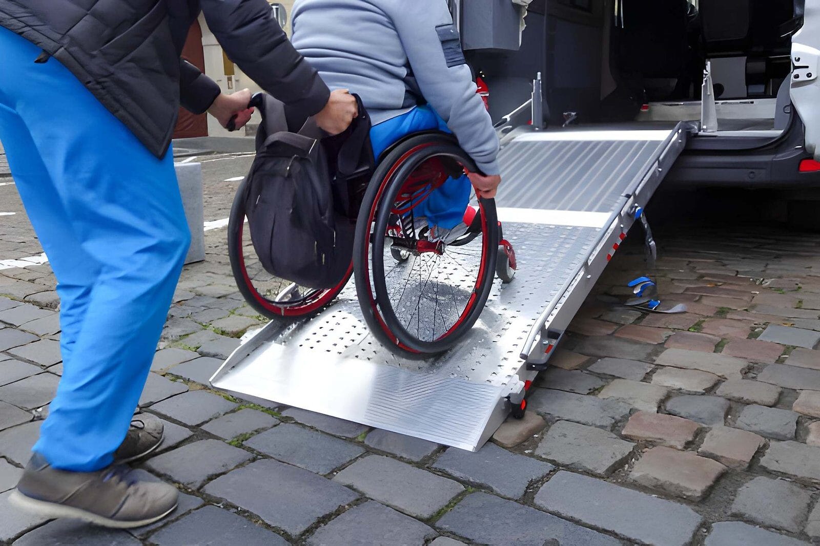 Man in a wheelchair on a ramp. - Care Transit Solutions